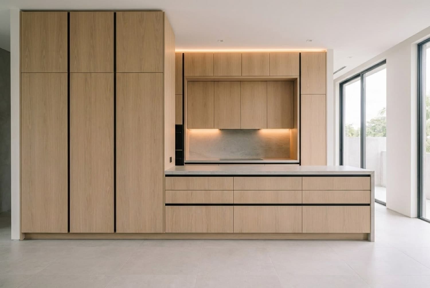 Custom kitchen in pale oak with flush handleless fronts, black shadow-gap reveals and a stone worktop